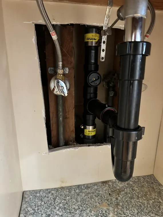 New ABS drain stack with a cleanout fitting installed in an open wall in Hillsboro, Oregon