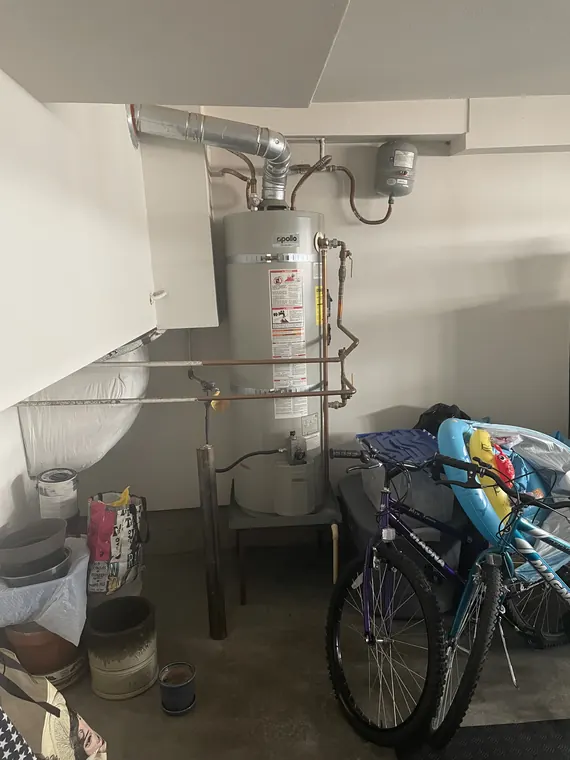 Replacement tank water heater installed in a garage with new copper lines and a seismic strap in Hillsboro, Oregon