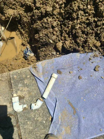 New water main line fittings laid out at an open excavation during a main line replacement in Hillsboro, Oregon